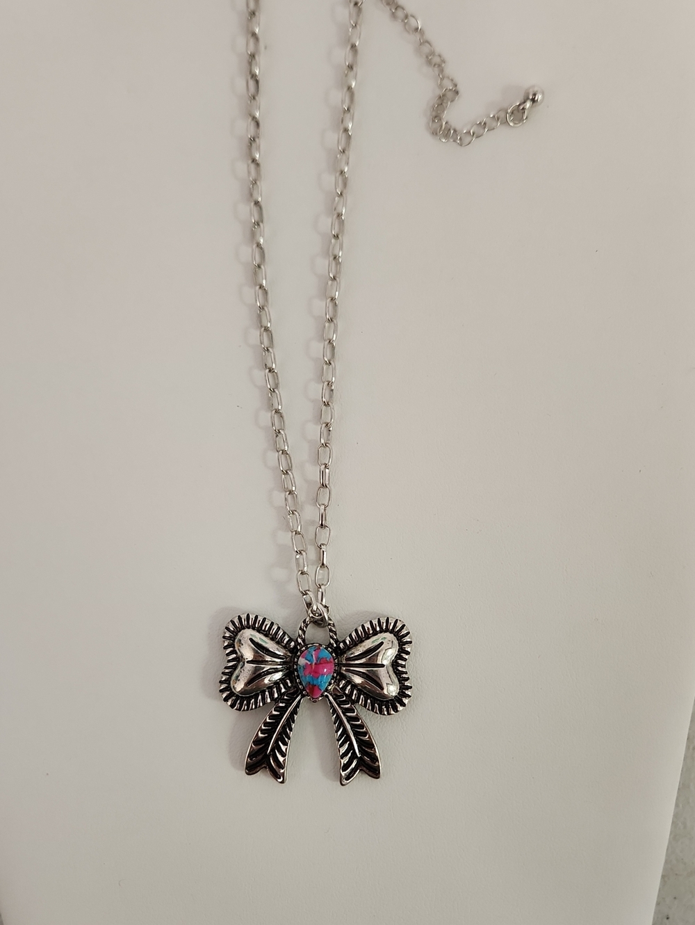Silver Bow Pendant Necklace with Pink-Blue Stone